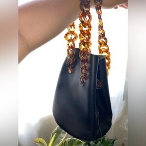 Faux Leather Bucket Bag with Tortoiseshell Chain